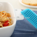 white ceramic bakeware with heat-resistant silicone handles